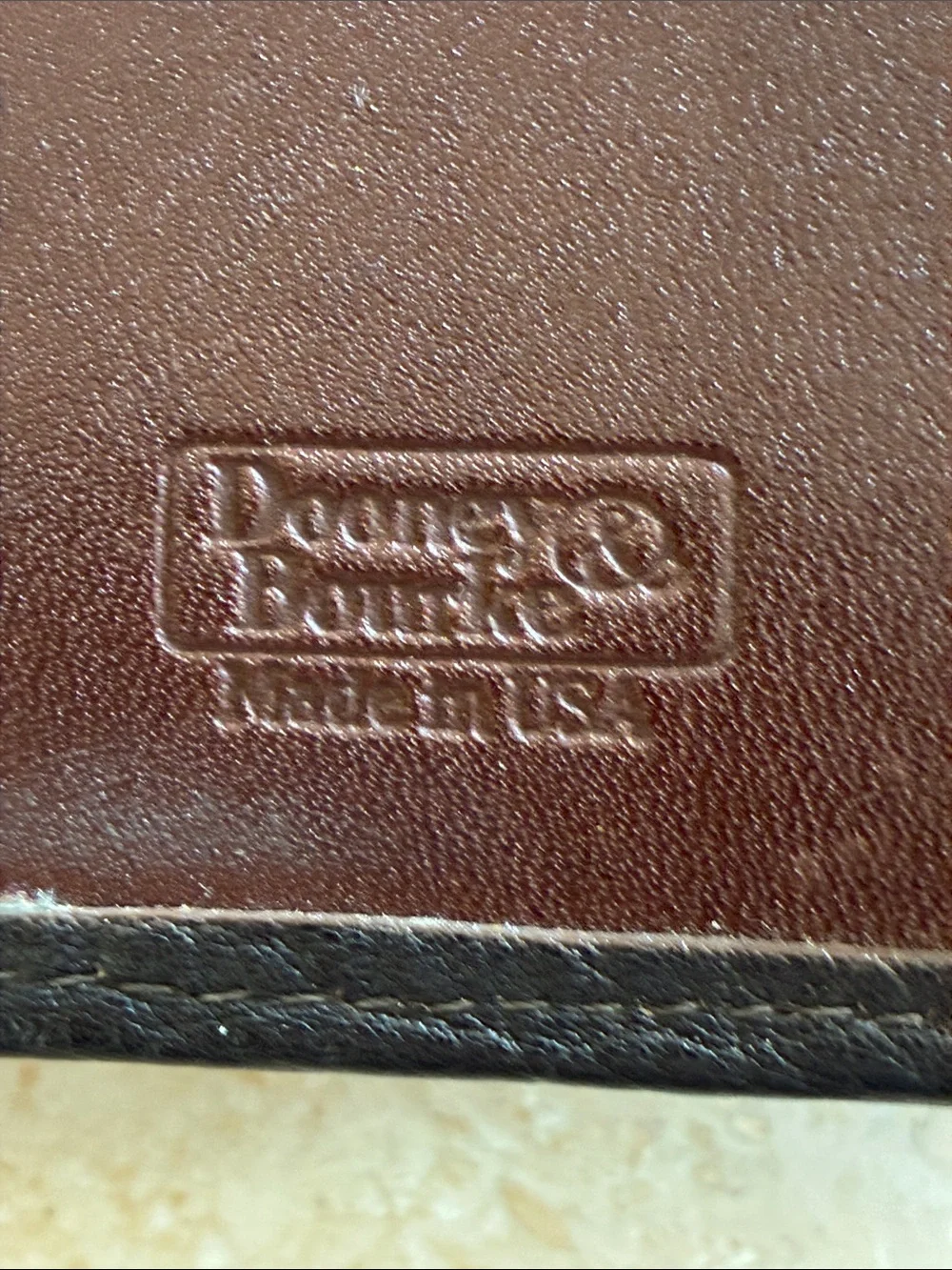 Dooney & Bourke wallet 1  Black Pebbled Leather Wallet with Brown Trim GUC